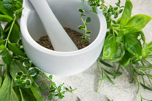 Mortar and pestle grinding fresh herbs for wellness, a Food & Drink Photo by Olena Rudo