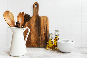 Kitchen utensils, tools and dishware on on the background white, a Food & Drink Photo by Olena Rudo