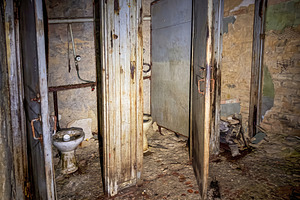 Toilet in old dark underground shelter, an Architecture Photo by Vapi