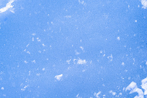 Blue rough ice texture with snow, winter background