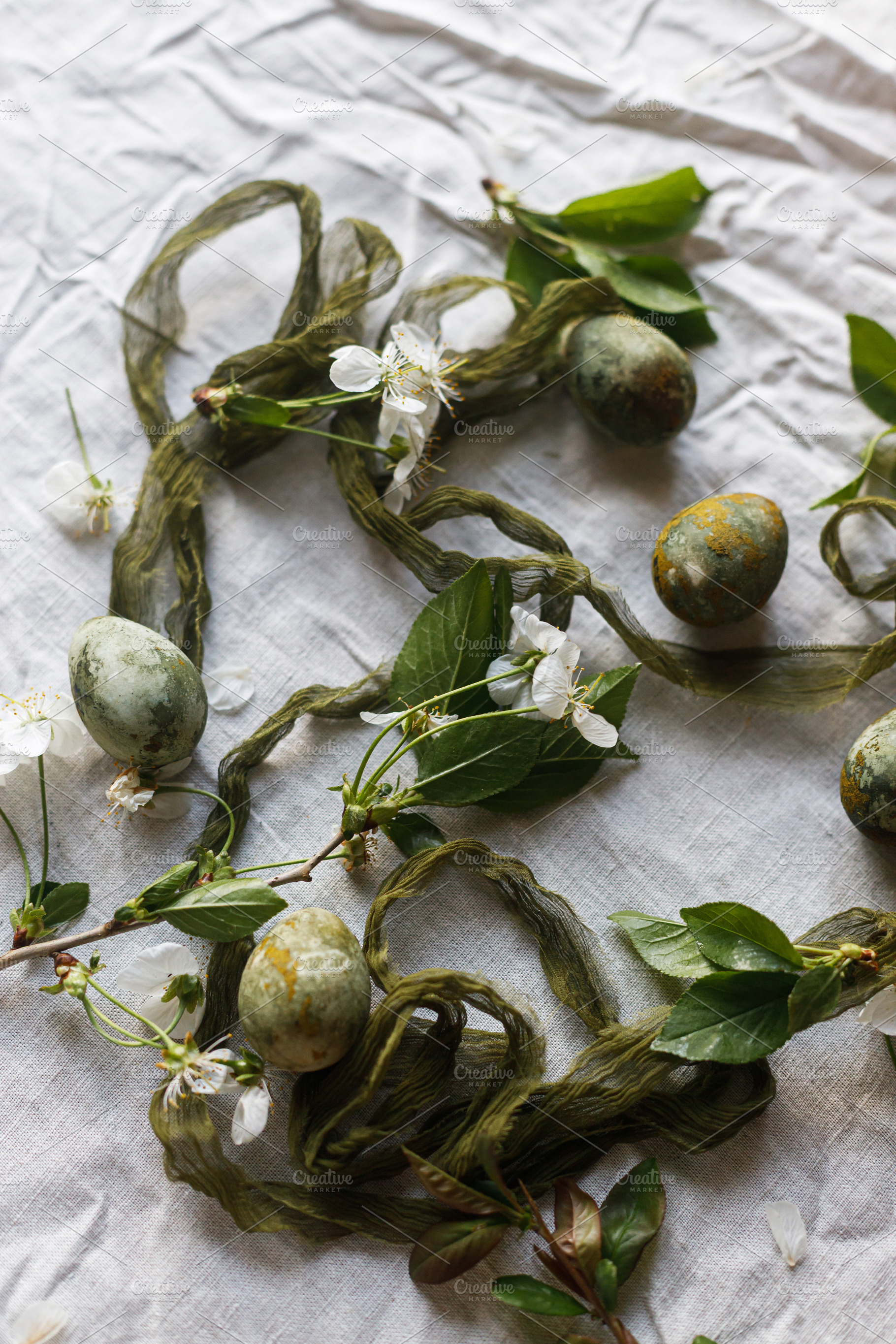 Easter celebration flat lay. Stylish green easter eggs, flowers,, a Holiday Photo by Sonjachni