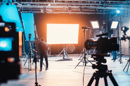 Videographer Filming in Studio with Professional Camera, a Photo by Natalia Klenova's Shop