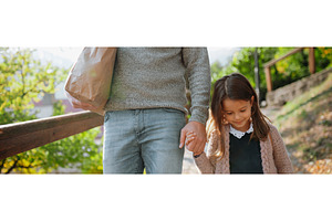 Parent walking child to school on, a School & Education Photo by HalfPoint