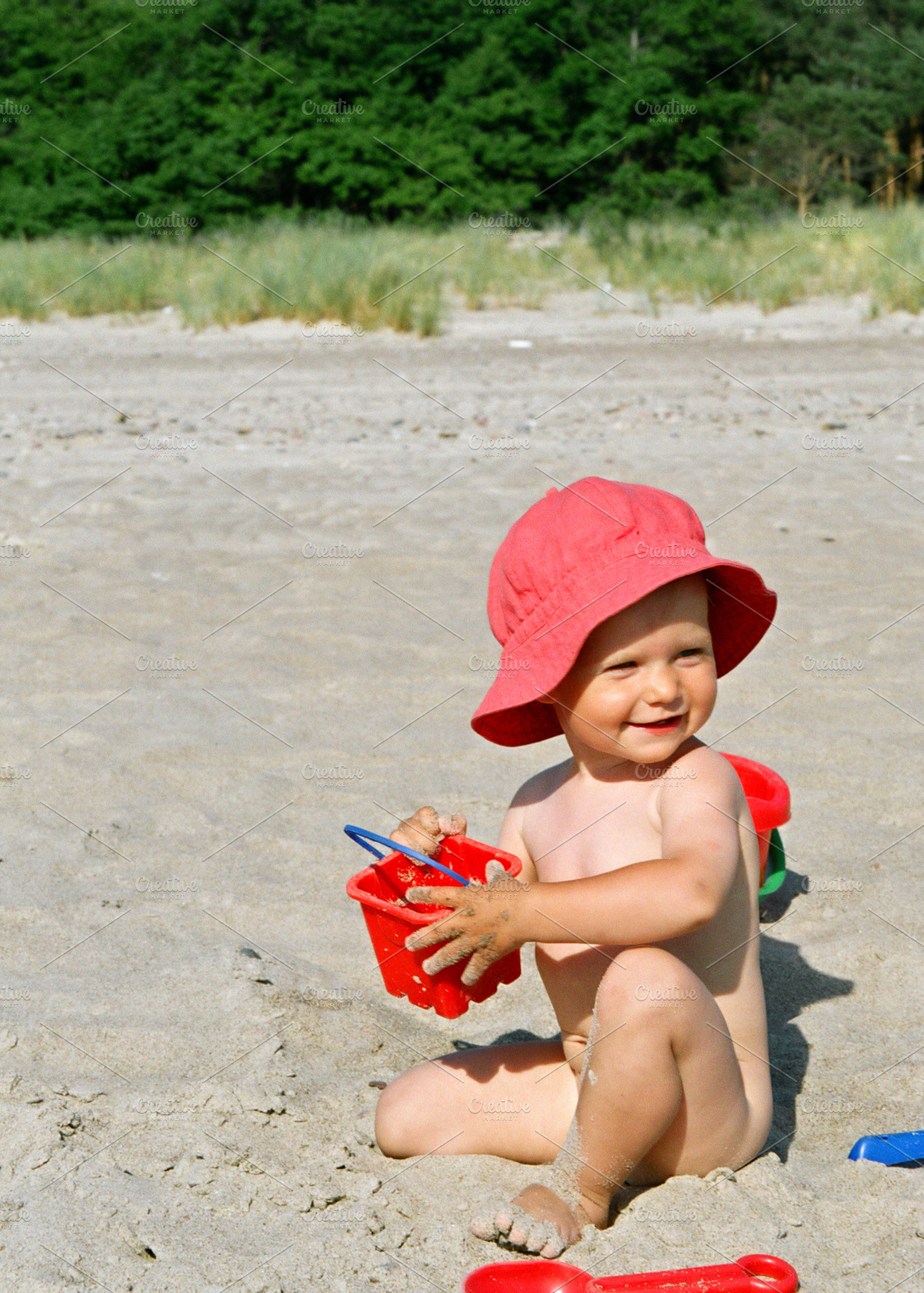 Toddler girl on the beach, a Person Photo by BOOCYS