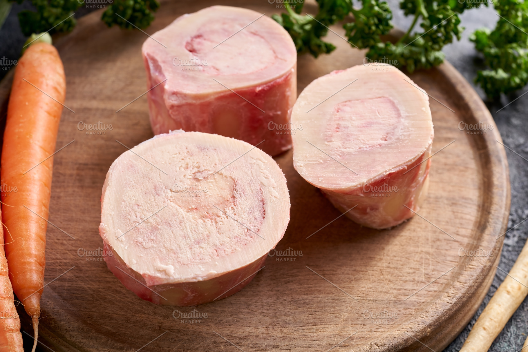 Raw marrow bones and vegetables - ingredients to make bone broth, a Food & Drink Photo by Madeleine Steinbach