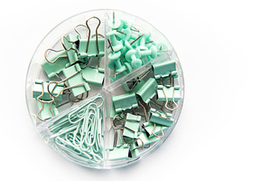 Mint green office supplies in clear organizer