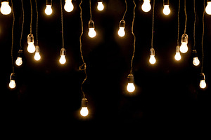 Light bulbs over dark texture