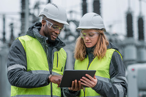 Engineers reviewing data on tablet a, a Photo by Pixeness Studio