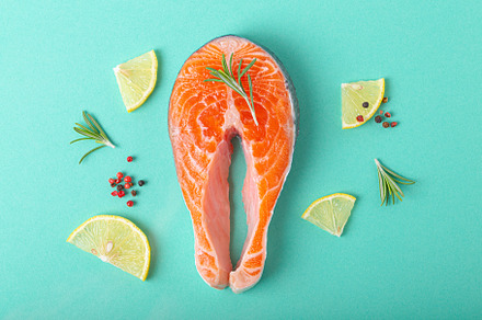 Raw fresh fish salmon steak top view on blue clean background fr, a Food & Drink Photo by its_al_dente