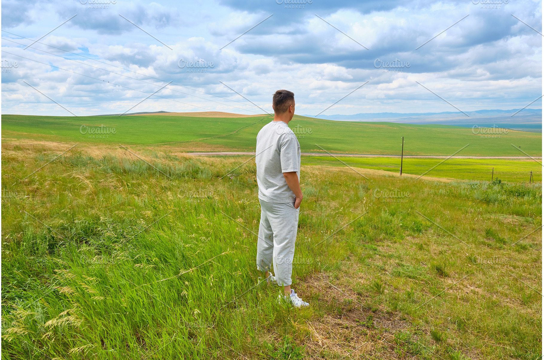 A man in light-colored clothes, a Person Photo by PhotoXab