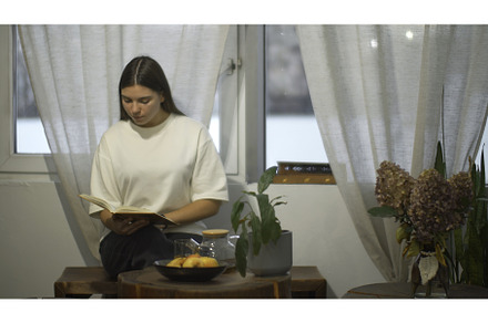 Young female student reads book in, a School & Education Photo by Media Whale Stock