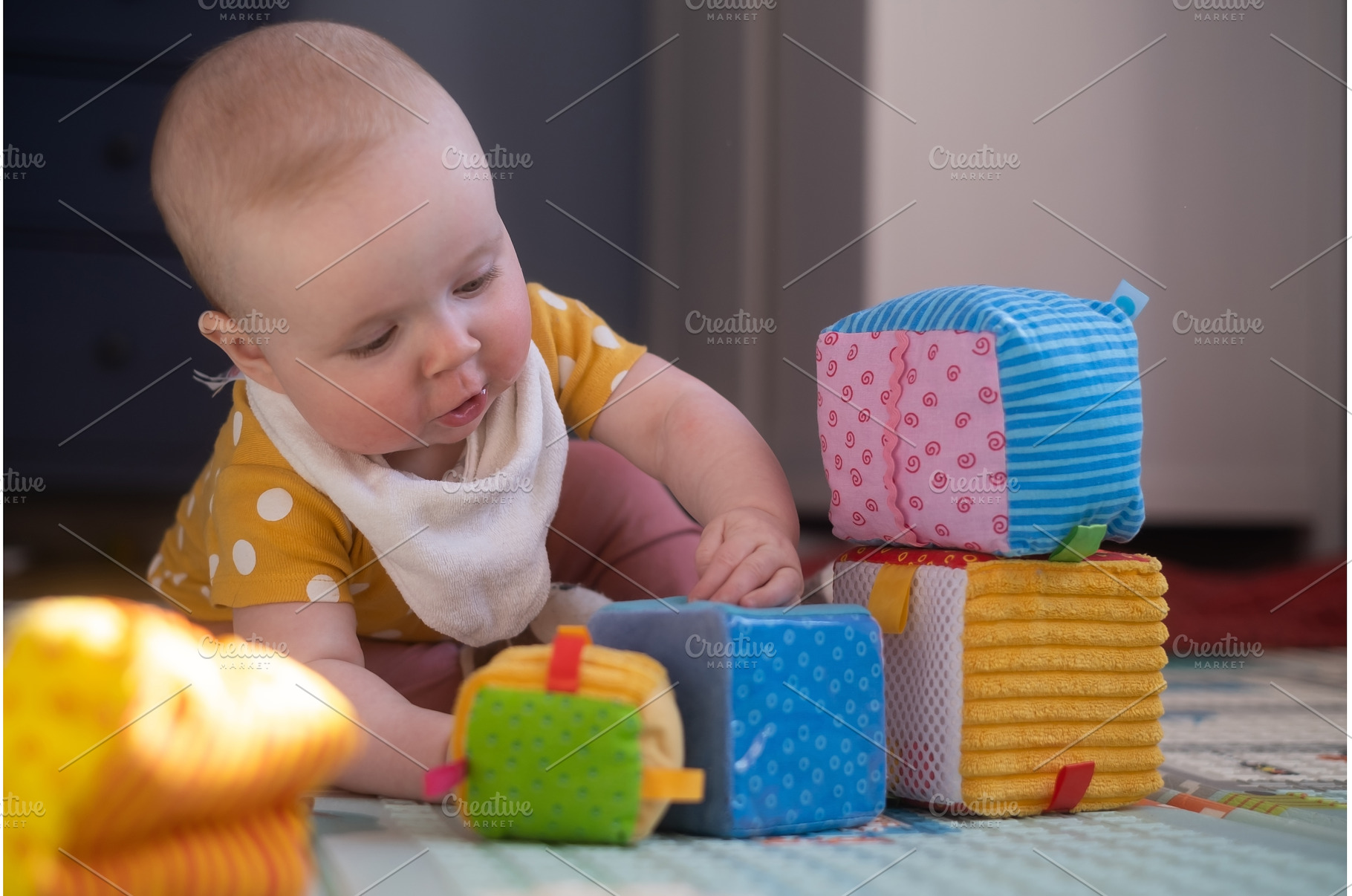 Caucasian baby toddler playing color, a School & Education Photo by Koldunova