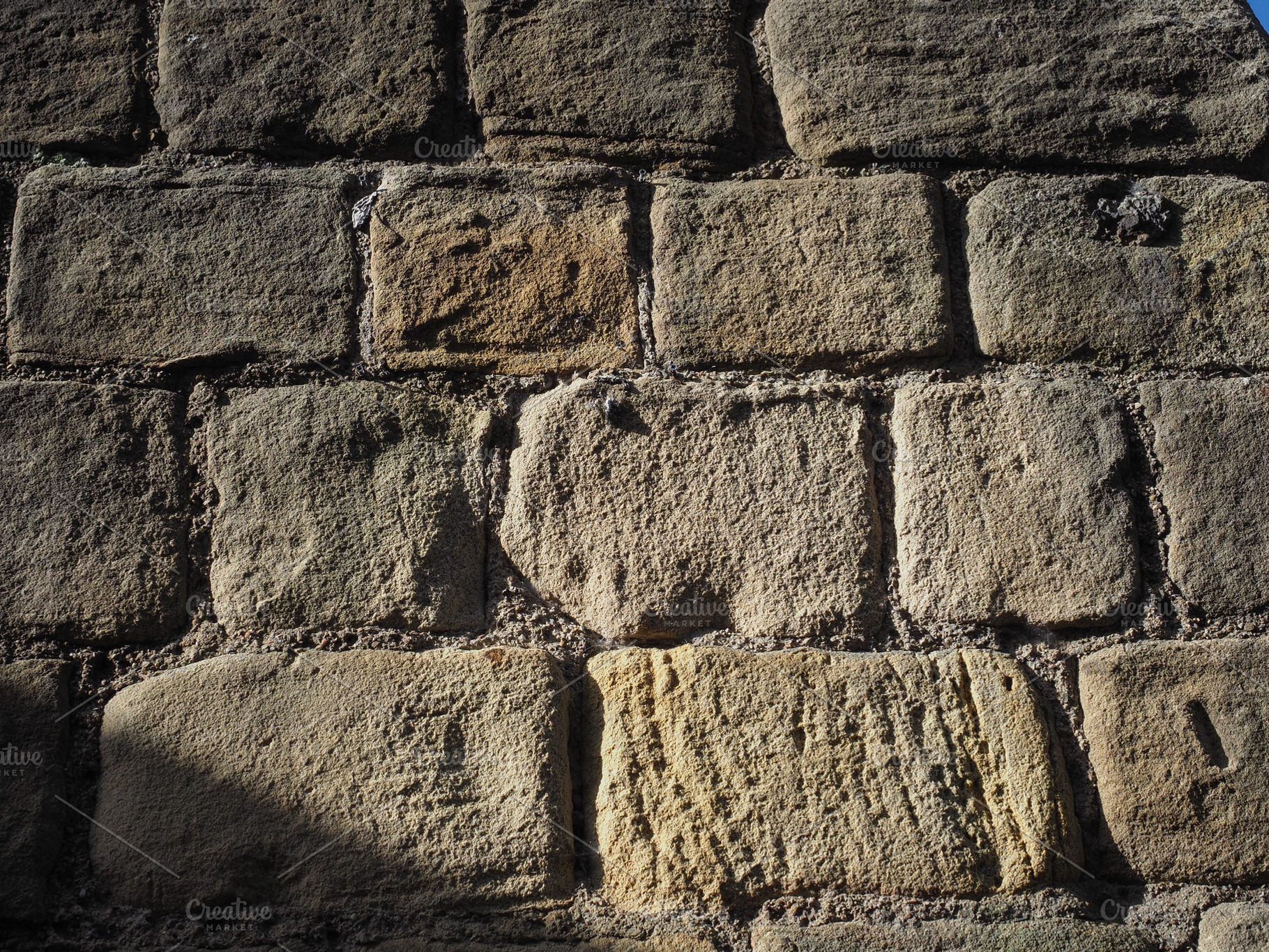 brown stone wall background, a Photo by WorldOfPhotos