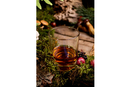 Whiskey glass among a wild natural, a Food & Drink Photo by JeanBet