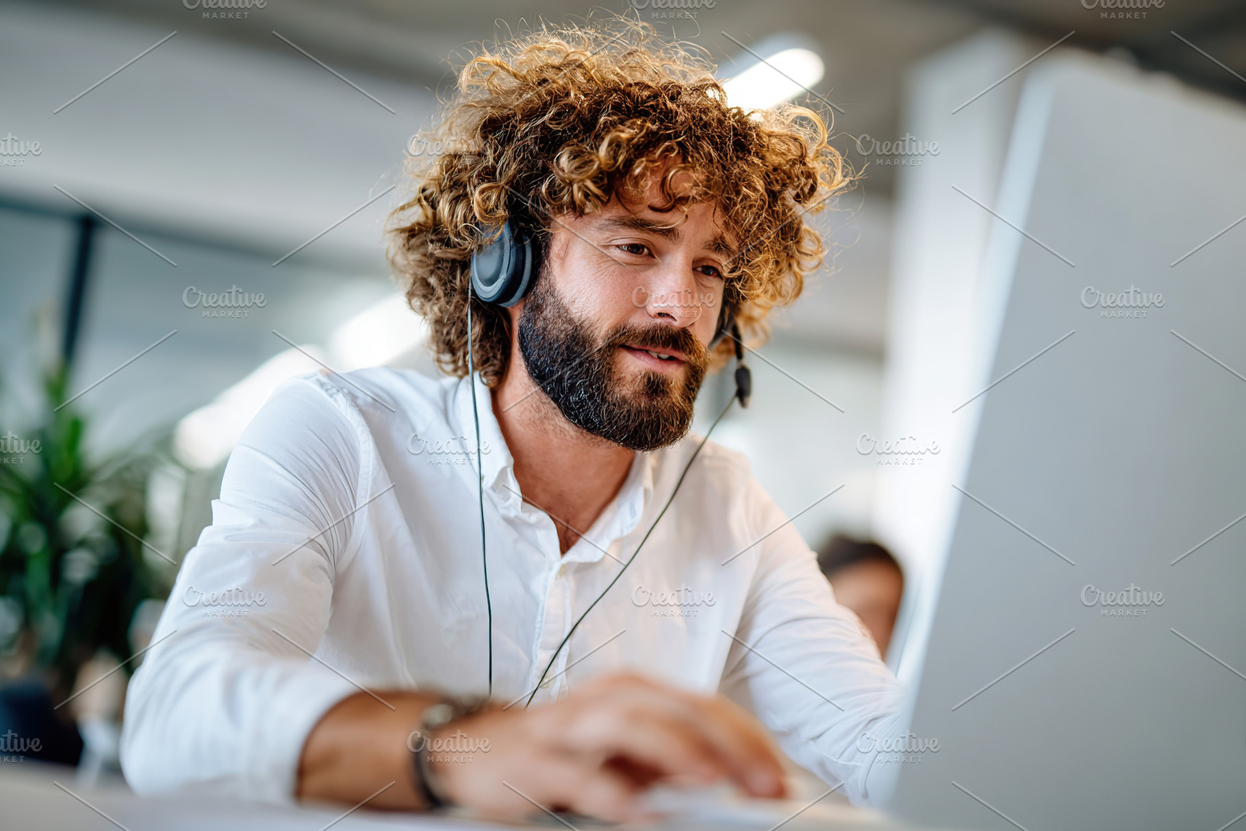 Service agent assisting clients in a modern workspace while wearing a white out, a Person Photo by AlyaAnd