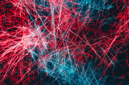 Vibrant red and blue light trails in, a Photo by Tanuart