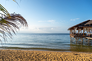 Wooden pier on the beach of Lake Poso, Tentena, Sulawesi, a Nature Photo by GoodGoods