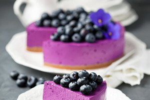 Blueberry cheesecake with fresh blueberries containing background, baked, and