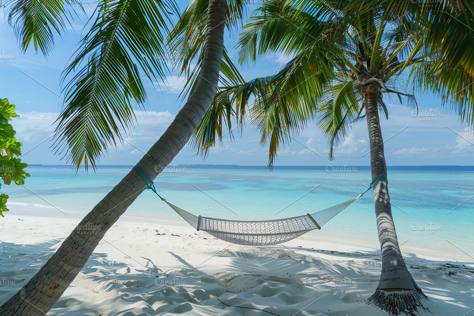 Beach hammock hanging between palm trees, a Photo by AlyaAnd