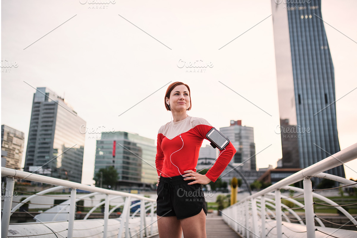Young woman with smartphone standing, a Graphic by HalfPoint