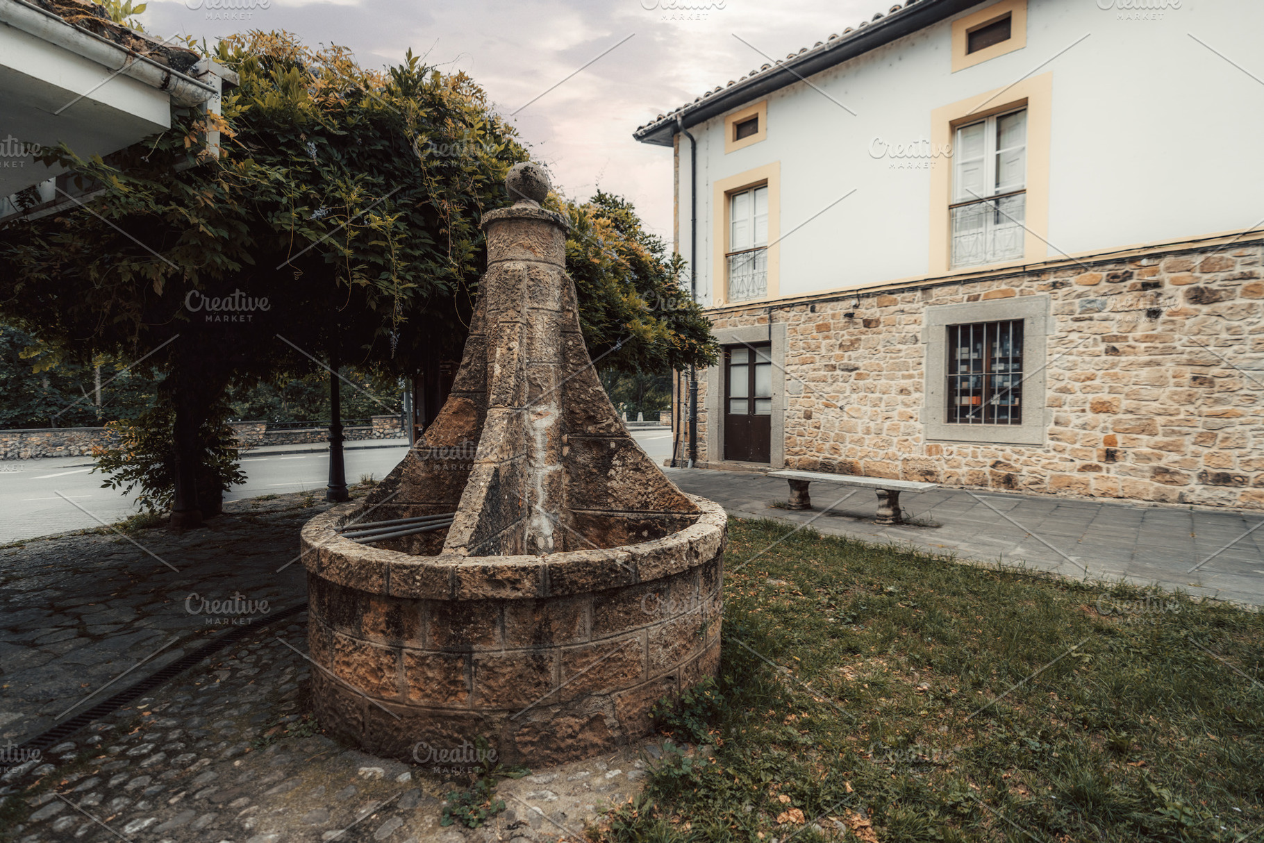 Stone fountain in Cabrales square, an Architecture Photo by SkyNext