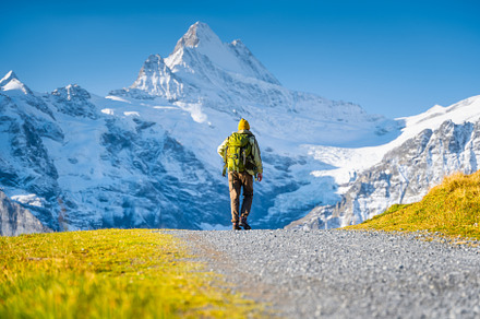 Mountain hiker with a backpack