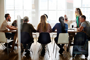 Diverse group of people in a seminar containing person, collaboration, and, a Person Photo by rawpixel