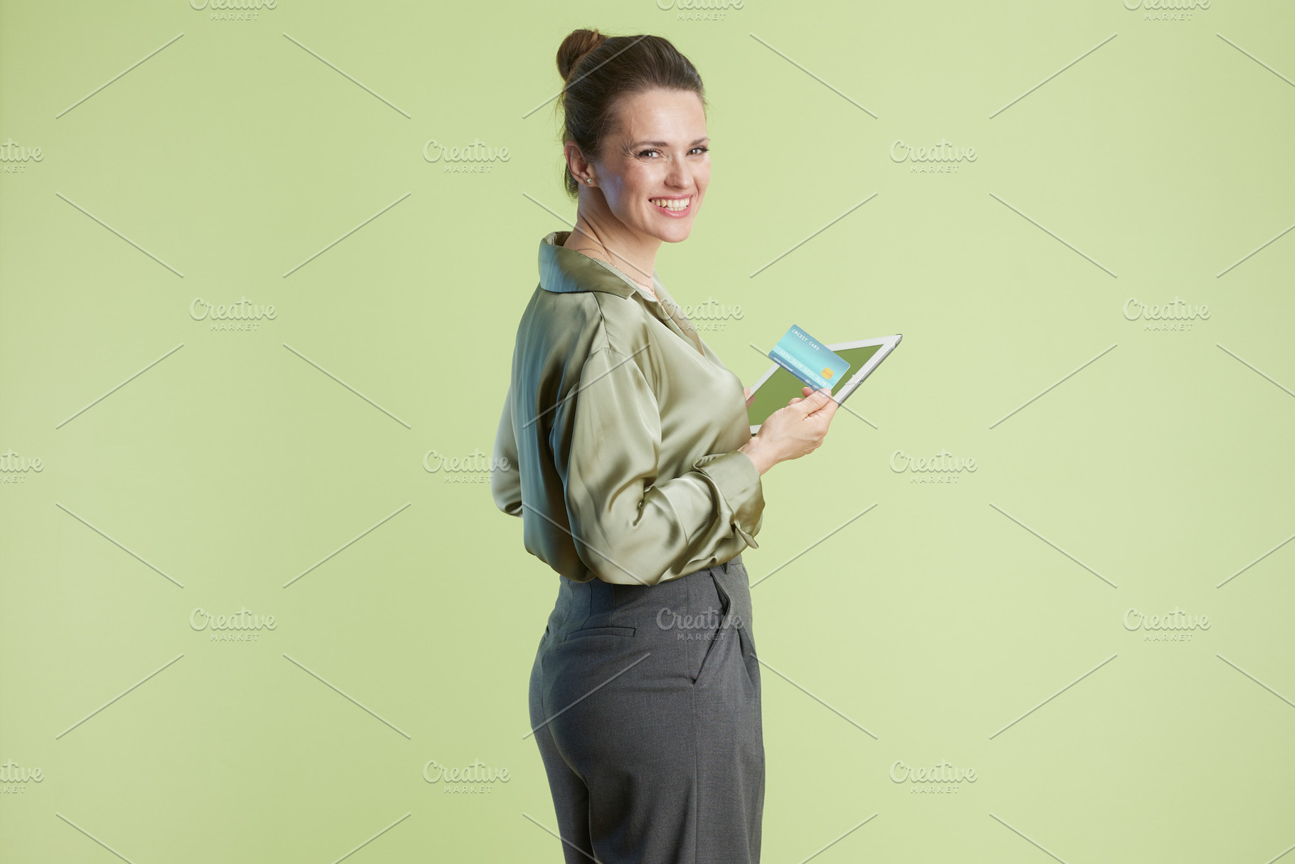 Woman with Tablet and Card: Online Finance, a Person Photo by Alliance Images