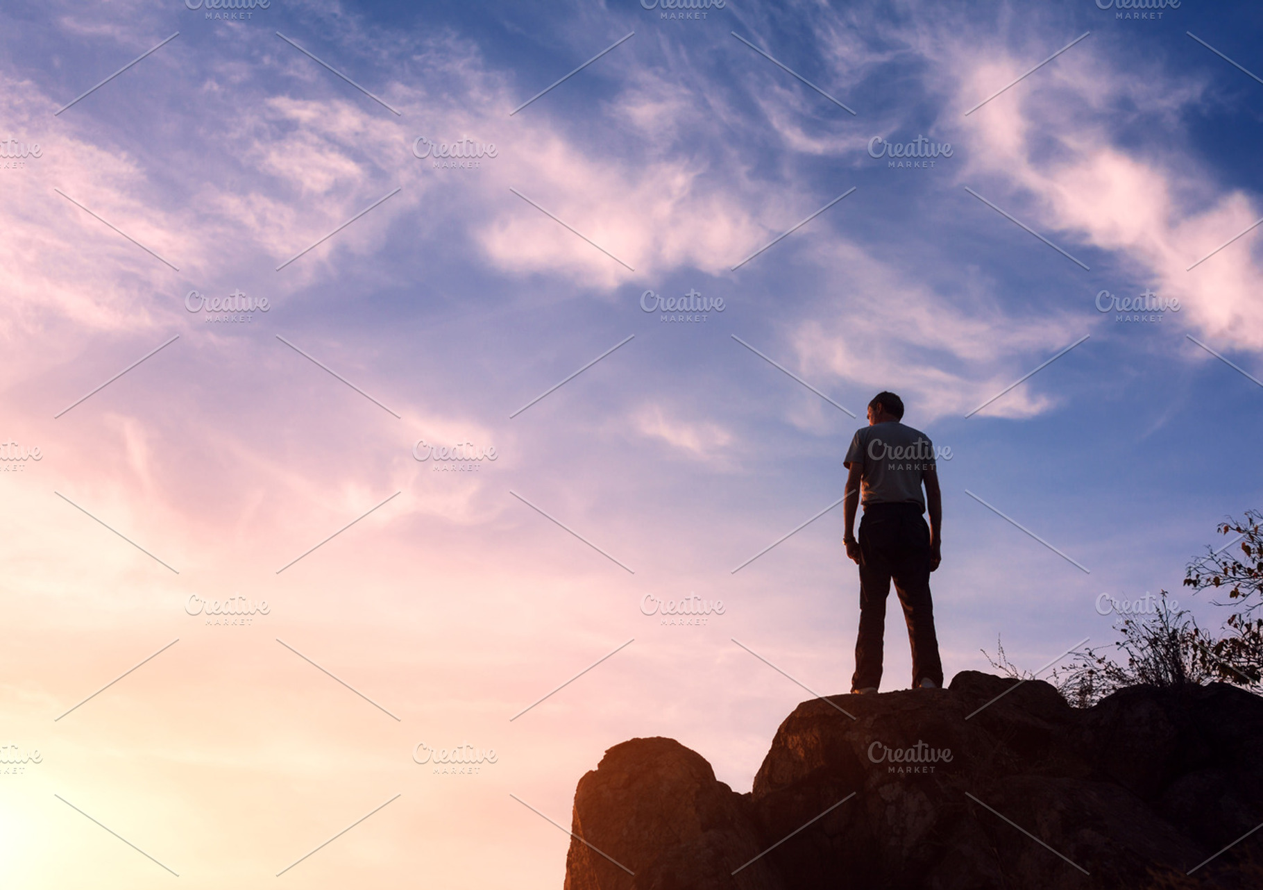 Silhouette of a man at the sunset containing man, silhouette, and sunset, a Person Photo by den-belitsky