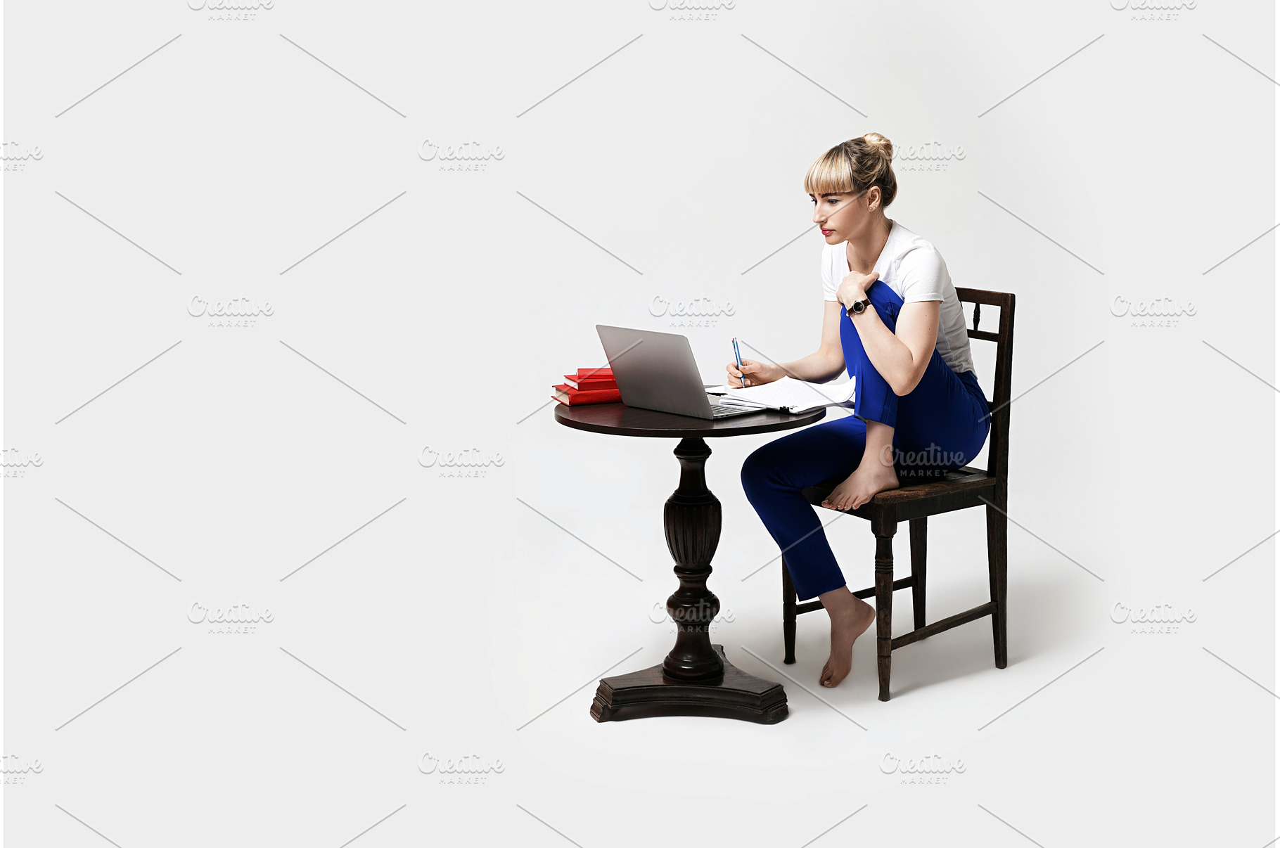 Focused young female student sitting, a School & Education Photo by Oleksandr Berezko