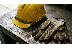 Worn yellow construction hard hat, an Industrial Photo by Igor Tichonow
