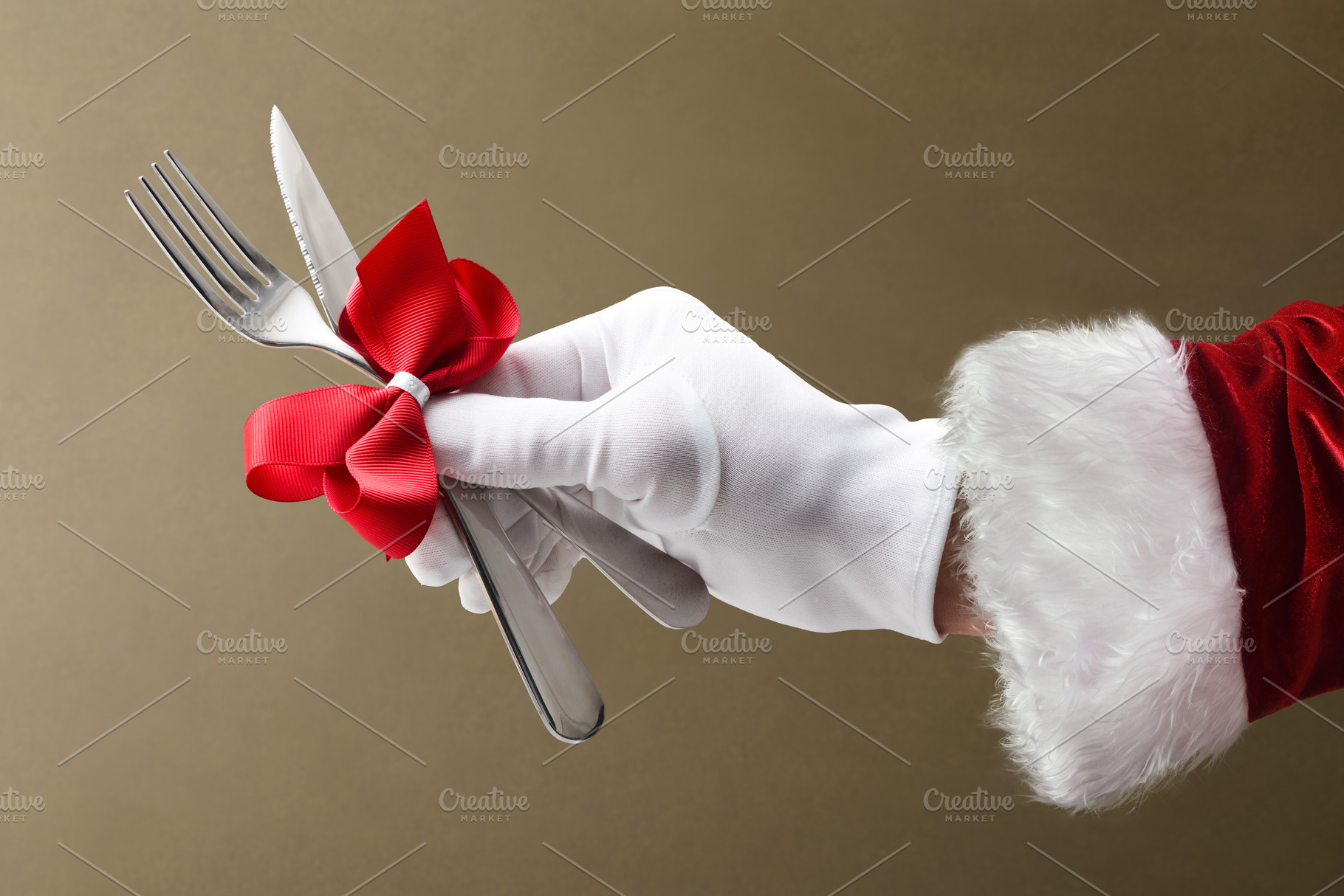 Christmas dinner with Santa's hand holding cutlery isolated brow, a Holiday Photo by Davizro's Market