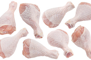 Raw chicken drumsticks isolated, a Photo by Max Lashcheuski