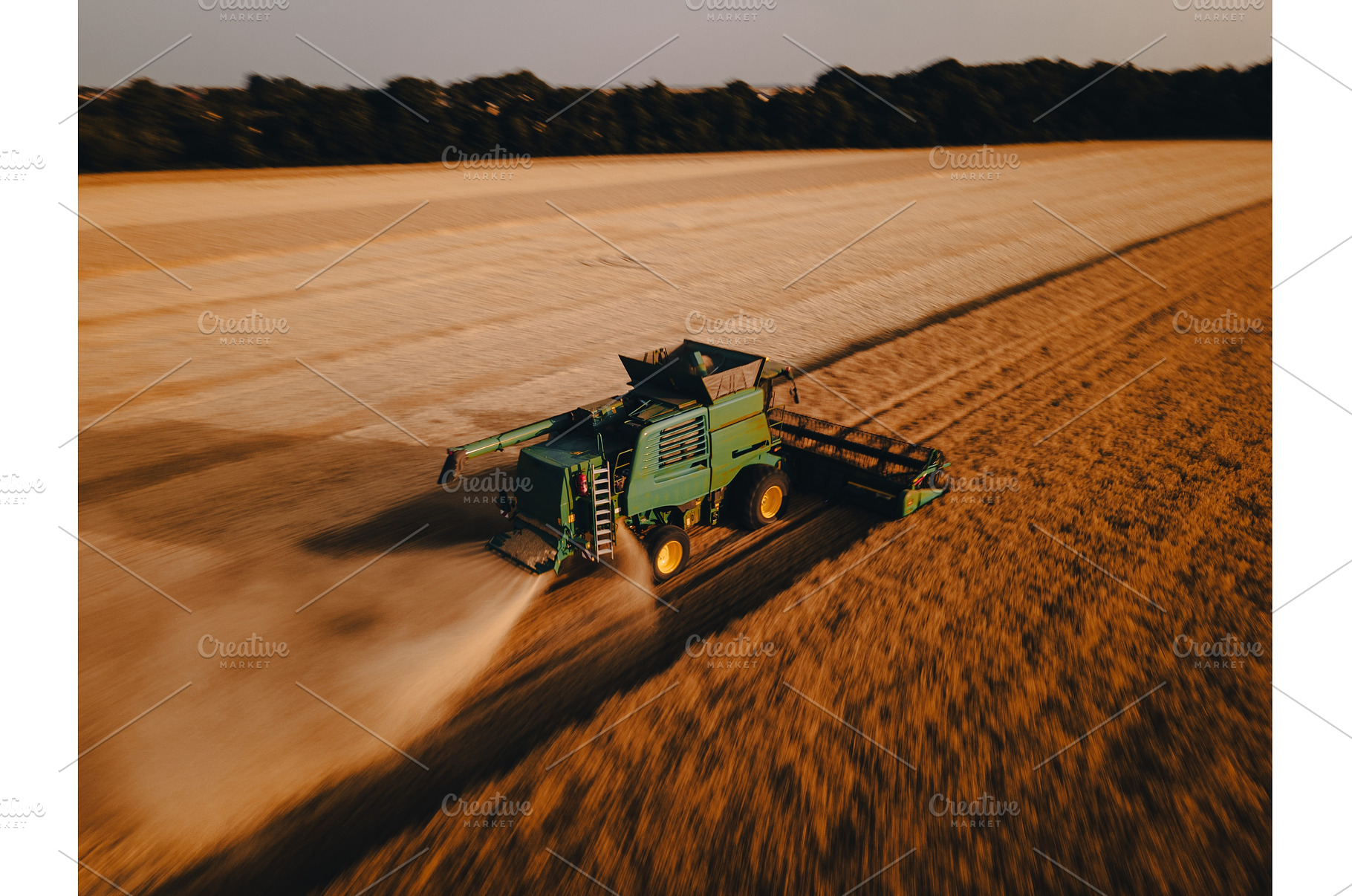 Aerial view of a harvester working, an Industrial Photo by HalfPoint