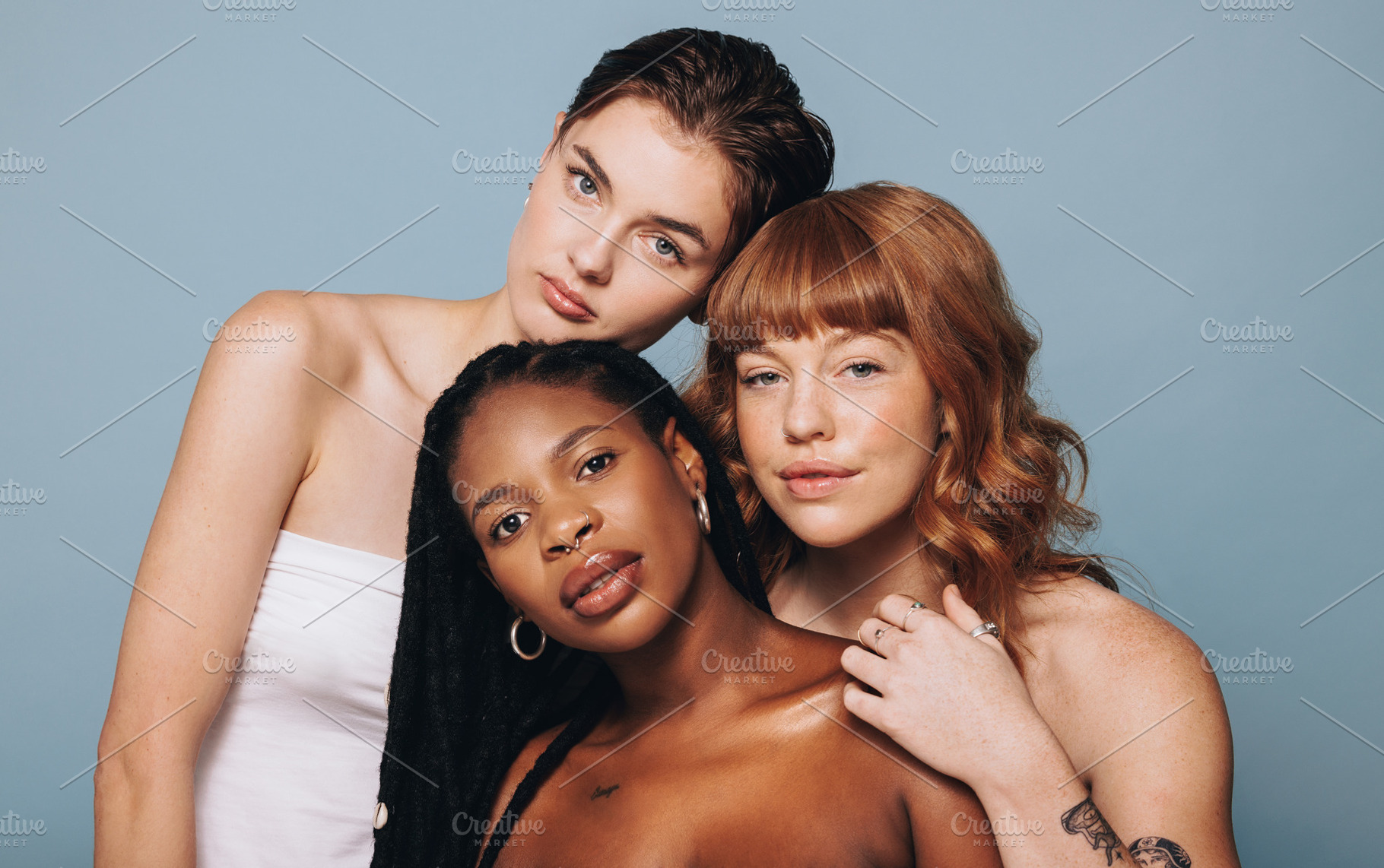 Women with different skin tones standing together, a Person Photo by Jacob Lund