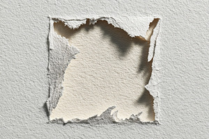 Torn Paper Reveals Beige Underlayer, a Photo by Pixeness Studio