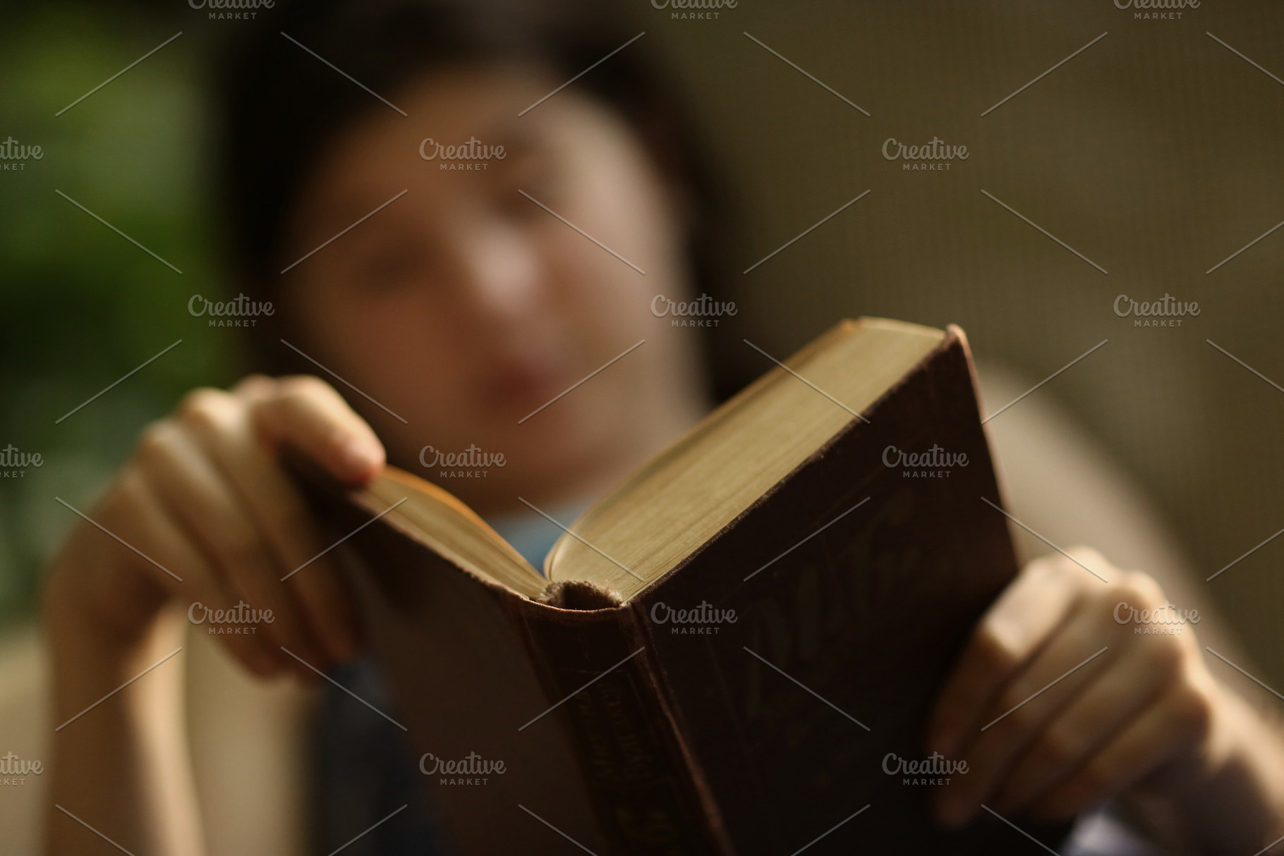 Teenager boy reading in hammock stock photo containing girl and book, a School & Education Photo by Famapictura