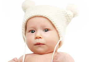 Newborn baby in the cap, a Photo by saiko3p