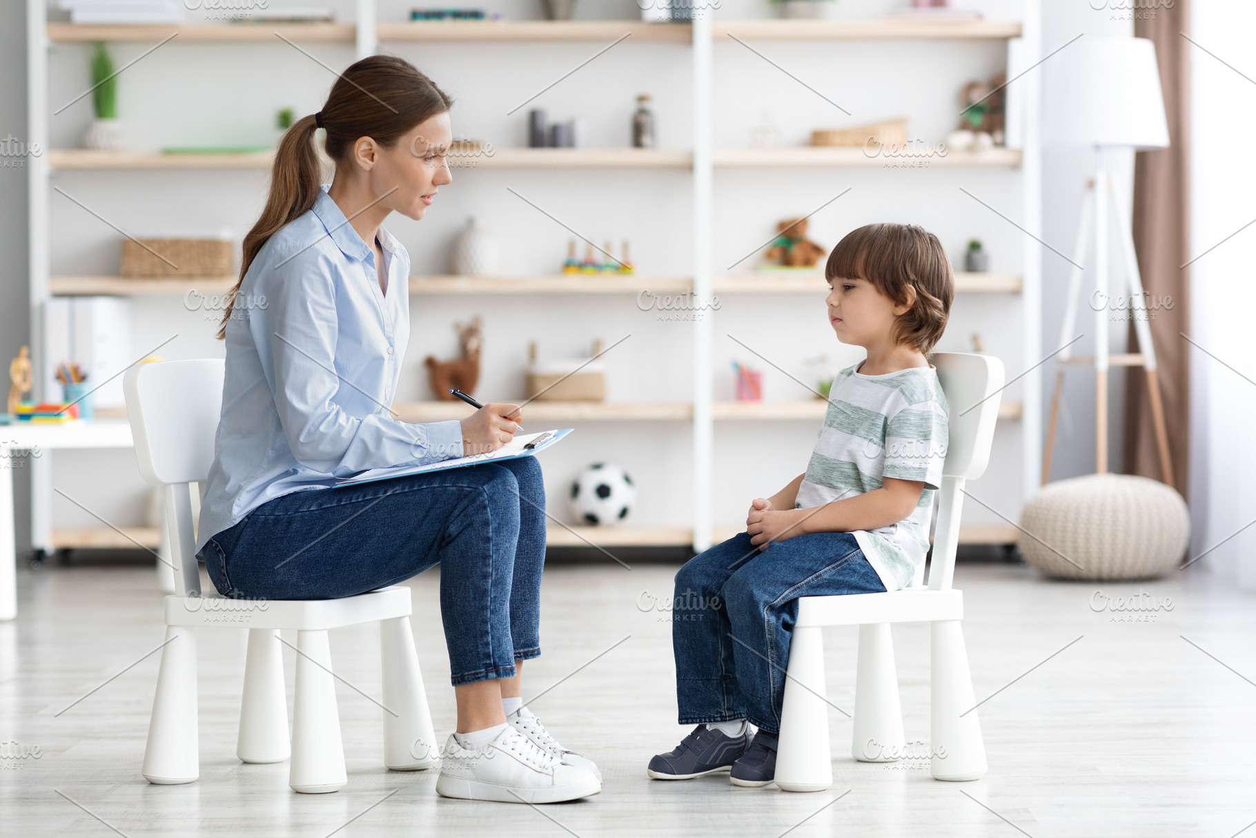 Psychological consultation for kids. Side view shot of professional woman psych, a Photo by Prostock-Studio