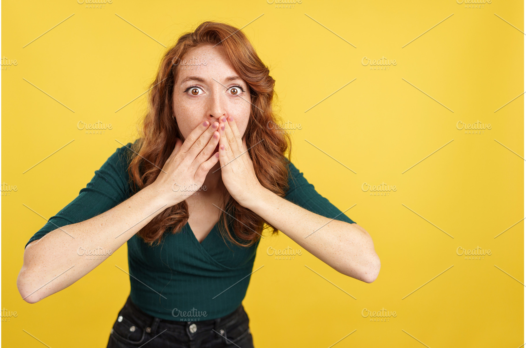 Redheaded woman covering the mouth, a Person Photo by Iván Moreno STOCK PHOTO