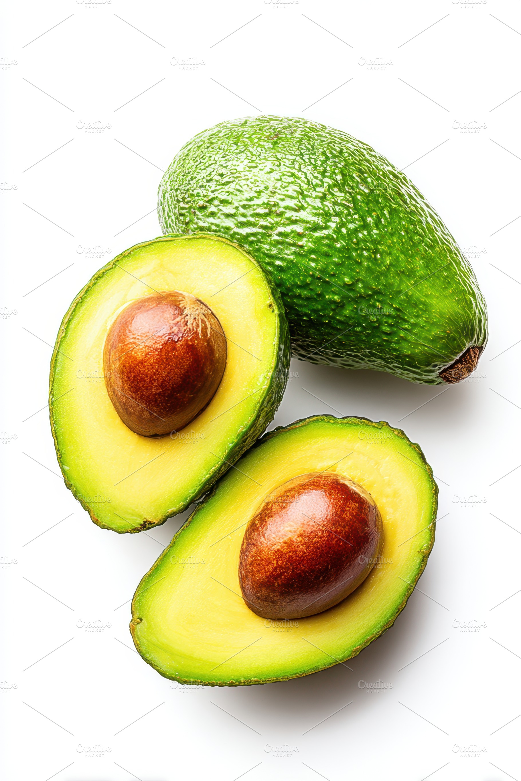 Fresh avocados cut in half on white background, a Food & Drink Photo by AlyaAnd