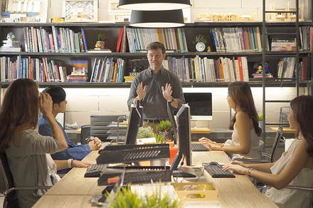 A group of multi ethnic business team talk, communicate, discuss, a Photo by Tampatra