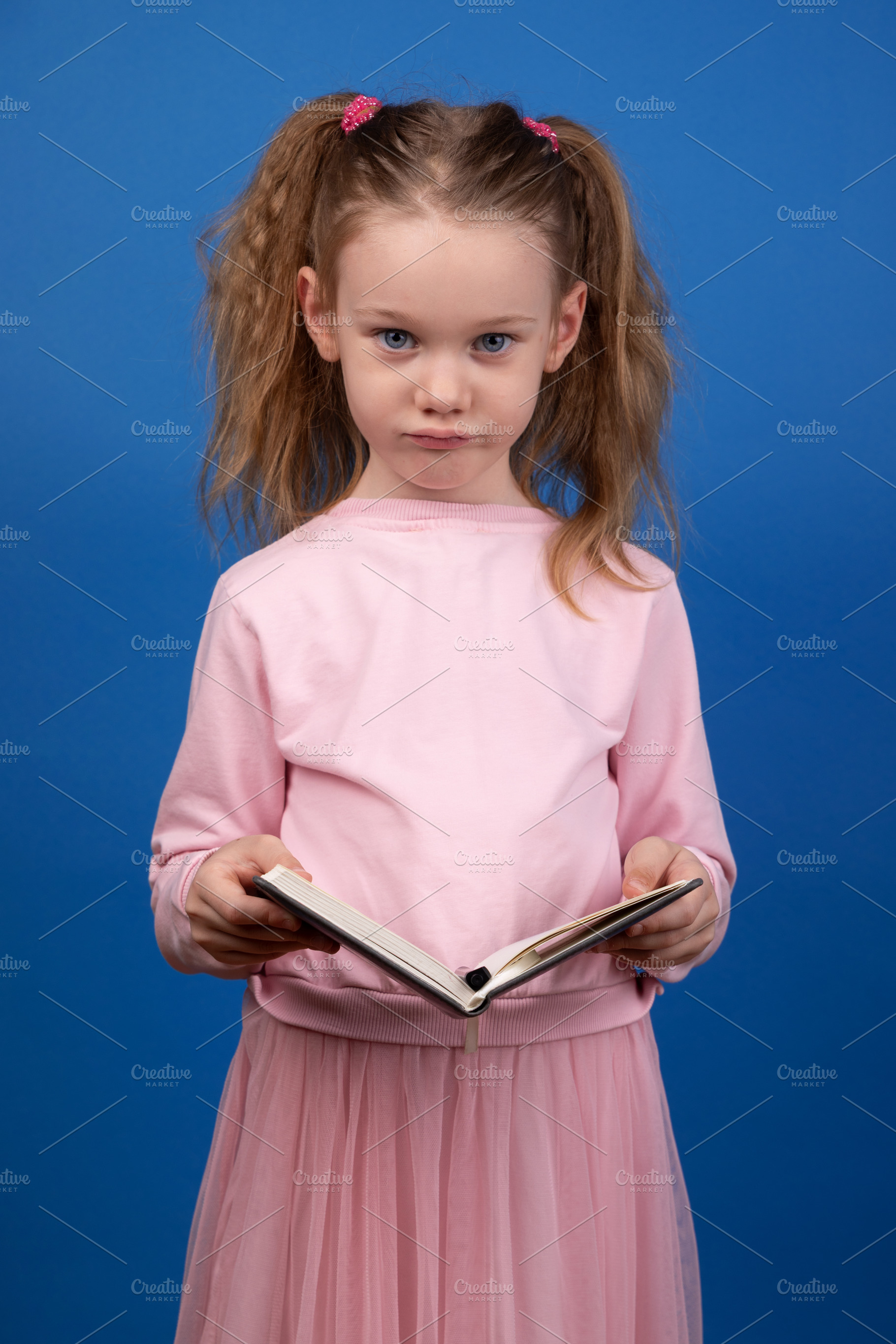 Serious Girl Reading Book, a Person Photo by Ales Munt