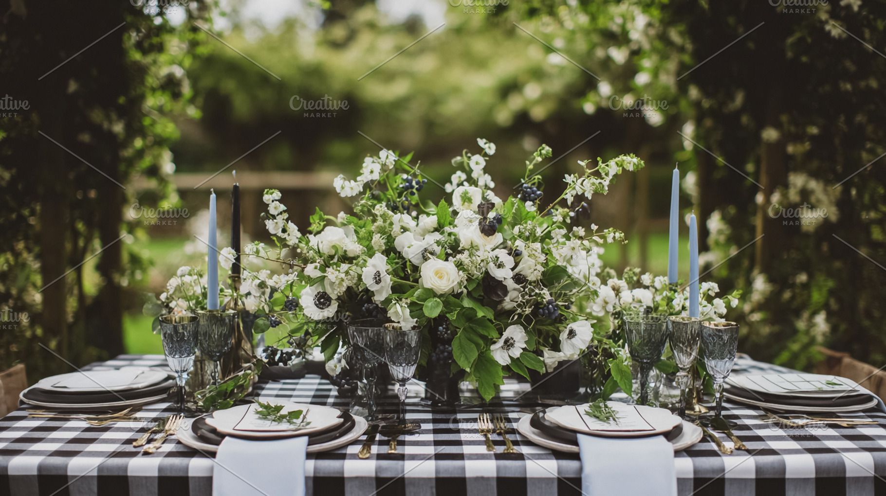 Rustic outdoor table setting showcasing a beautiful floral cente, a Photo by Studio ANNA