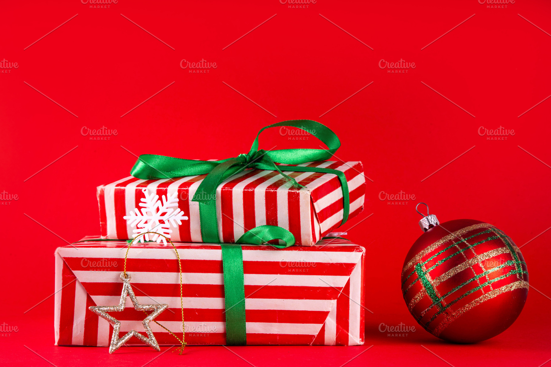 Bright high-colored background with Christmas boxes, festive bau, a Holiday Photo by Rimma