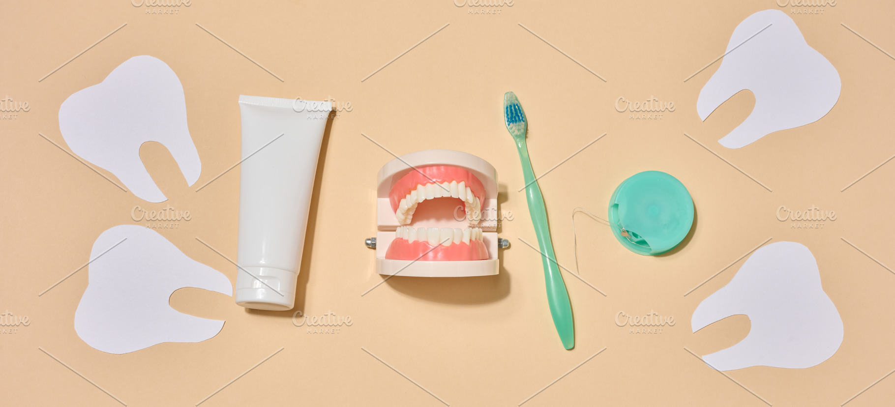 A tube of toothpaste, a toothbrush, dental floss, and decorative, a Health & Medical Photo by ndanko