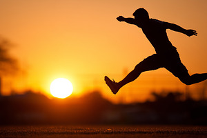 Silhouette of a man leaping in front, a Sports & Recreation Photo by MistyDay
