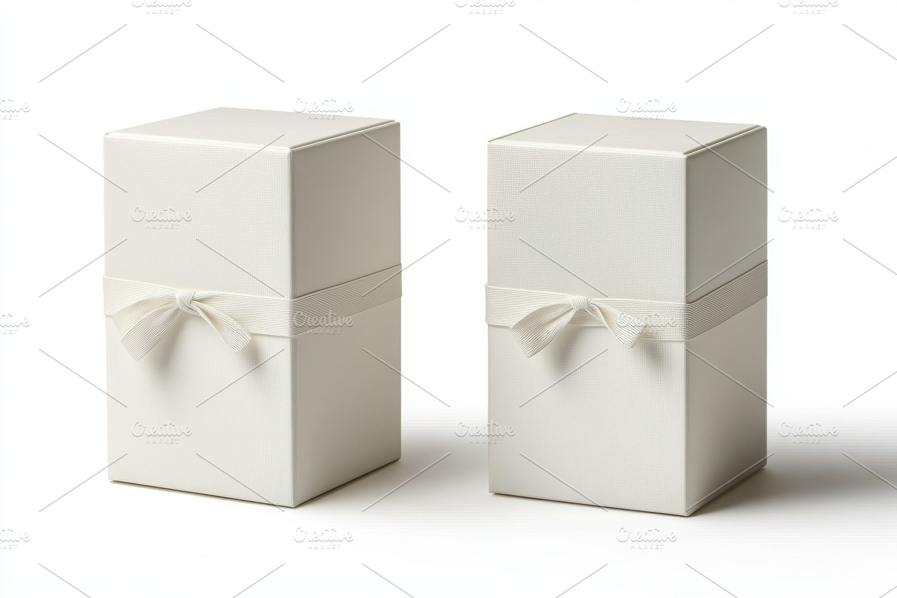 Elegant white gift boxes with ribbon, a Background Photo by Pixeness Studio