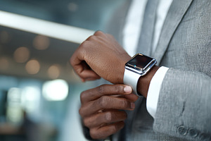 Man checks time on smartwatch, a Photo by Beautiful things