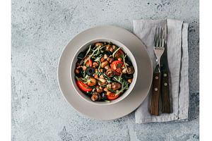 Salad with arugula, mini champignons, a Food & Drink Photo by Fascinadora